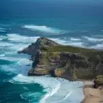 Aerial shot of a rocky shoreline of Cape Point, South Africa.