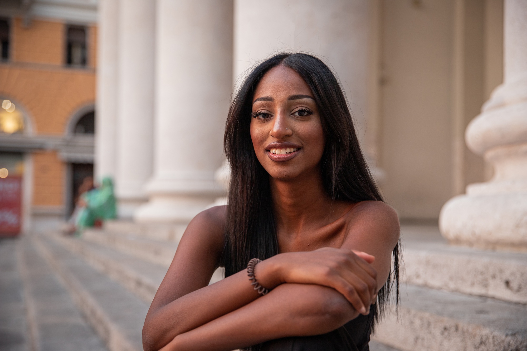 Portrait of an eastern african girl, smiling young lady outdoor in the city center.