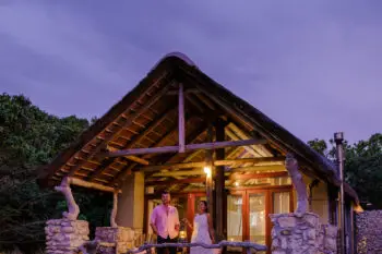Mountains and grassland near Hermanus at the Garden Route Western Cape South Africa Whale coast. A couple man and woman mid age in front of their lodge during a vacation in South Africa